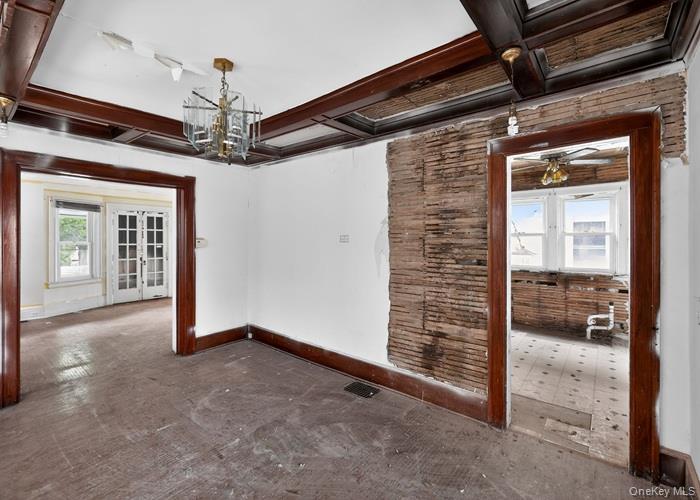 63 Rugby Avenue Rochester, NY 14619 - Photo 11 of 23 a view of a hallway with a chandelier