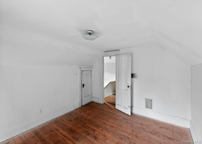 63 Rugby Avenue Rochester, NY 14619 - Photo 12 of 23 a view of empty room with wooden floor