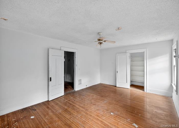 63 Rugby Avenue Rochester, NY 14619 - Photo 16 of 23 a view of an empty room with wooden floor