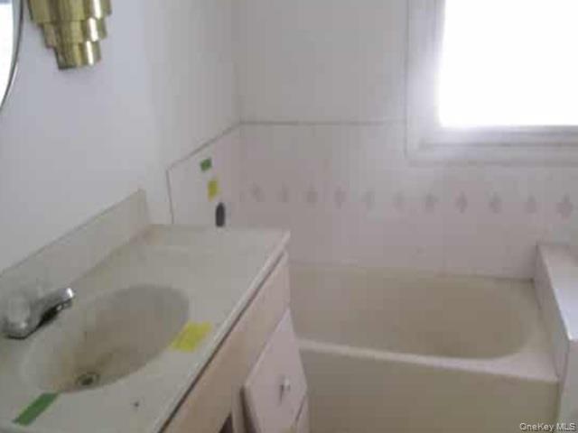 63 Rugby Avenue Rochester, NY 14619 - Photo 23 of 23 a bathroom with a tub