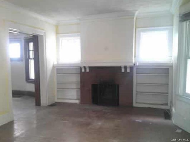 63 Rugby Avenue Rochester, NY 14619 - Photo 3 of 23 a view of an empty room and fire place
