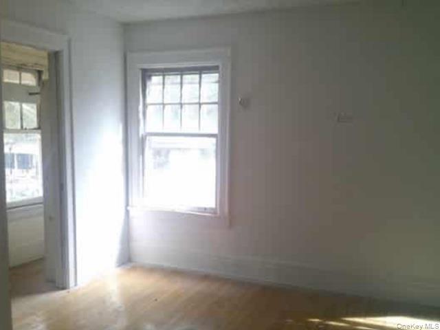 63 Rugby Avenue Rochester, NY 14619 - Photo 7 of 23 an empty room with a window