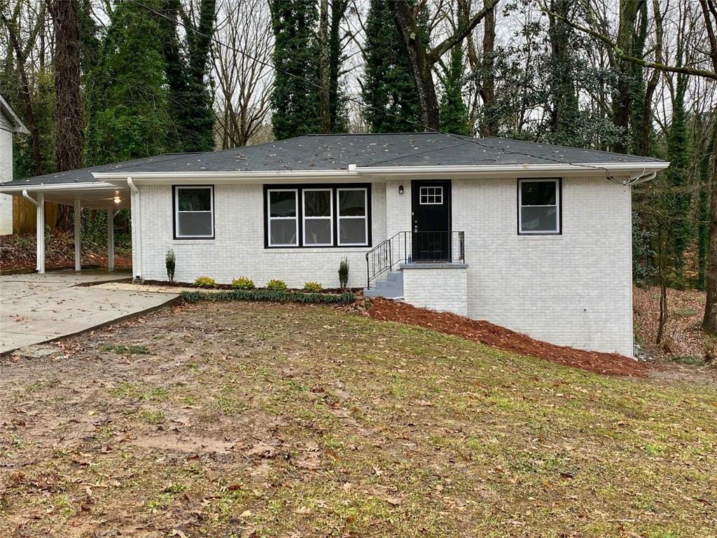 2785 Rockcliff Road Southeast Atlanta, GA 30316 - Photo 1 of 1 Exterior whitewashed brick, new windows and roof