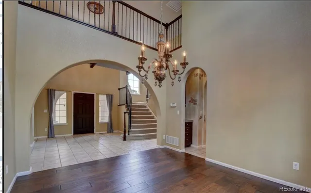 a kitchen with sink and refrigerator