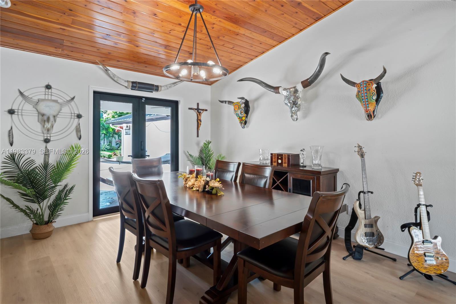 10320 Southwest 139th Street Miami, FL 33176 - Photo 13 of 100 a view of a dining room with furniture window and wooden floor