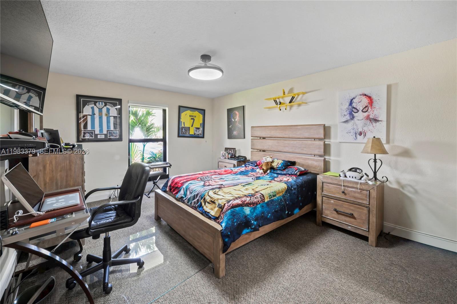 10320 Southwest 139th Street Miami, FL 33176 - Photo 17 of 100 a bedroom with a bed and a desk in it