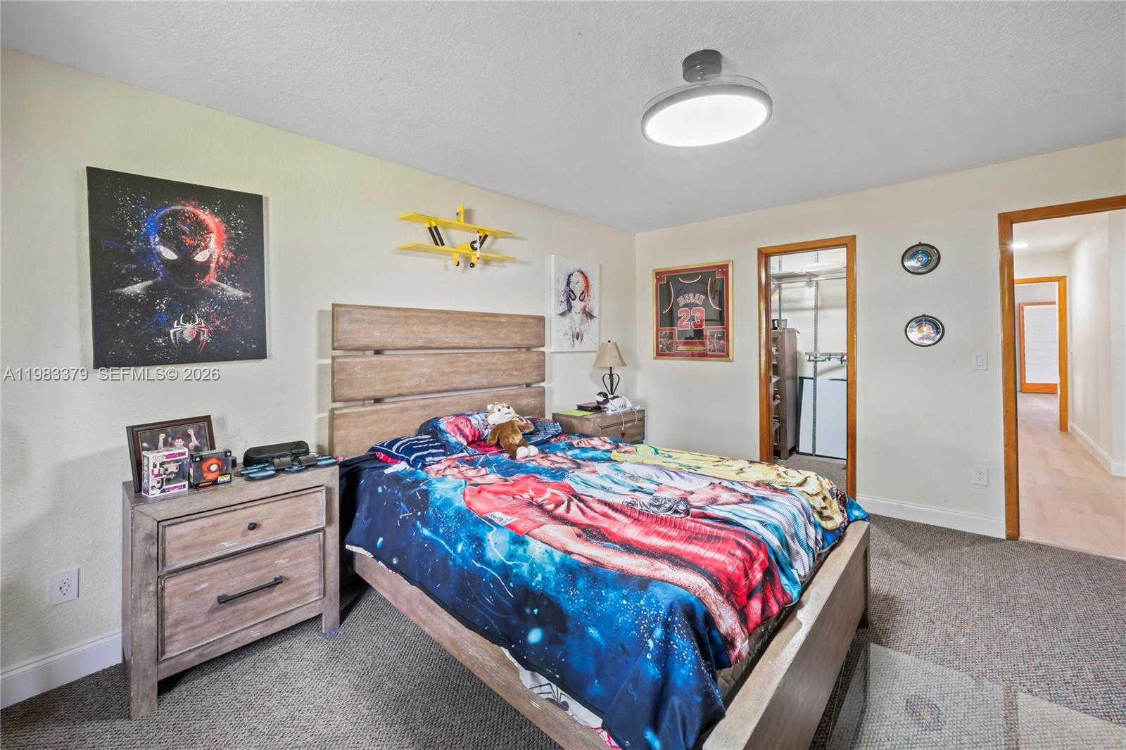 10320 Southwest 139th Street Miami, FL 33176 - Photo 18 of 100 a bedroom with a bed and a chandelier