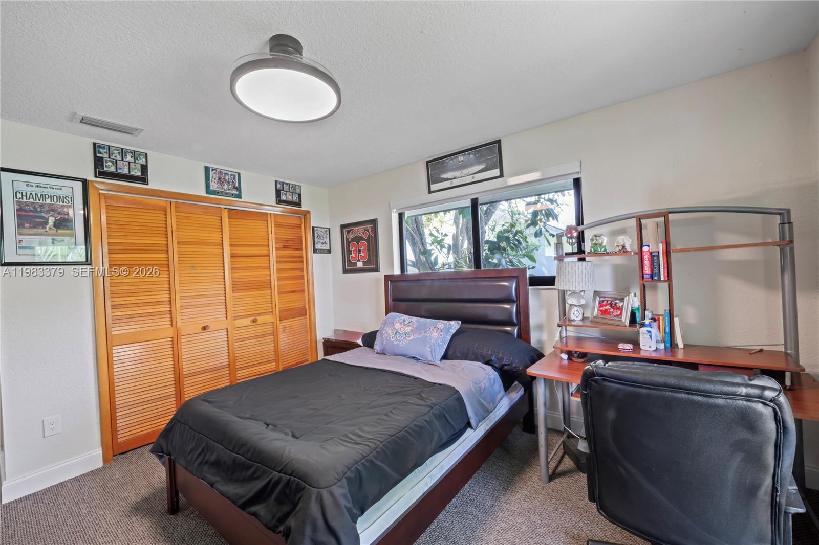 10320 Southwest 139th Street Miami, FL 33176 - Photo 22 of 100 a bedroom with a bed and a window