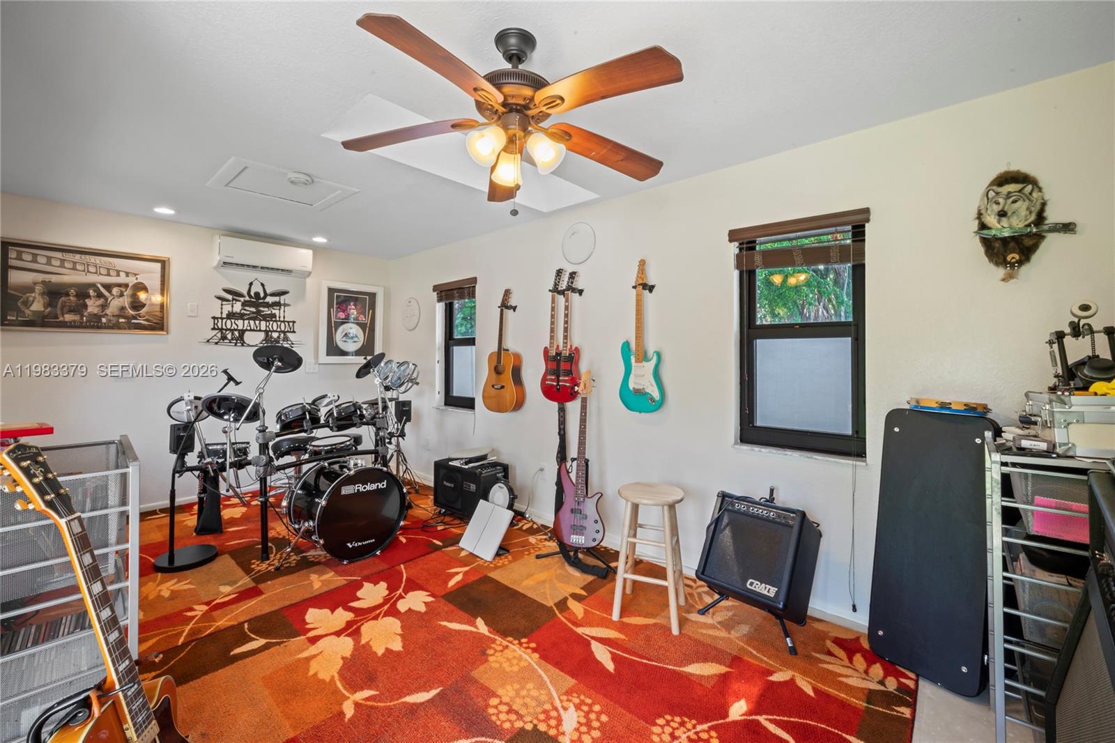 10320 Southwest 139th Street Miami, FL 33176 - Photo 49 of 100 a view of a livingroom with furniture and a flat screen tv