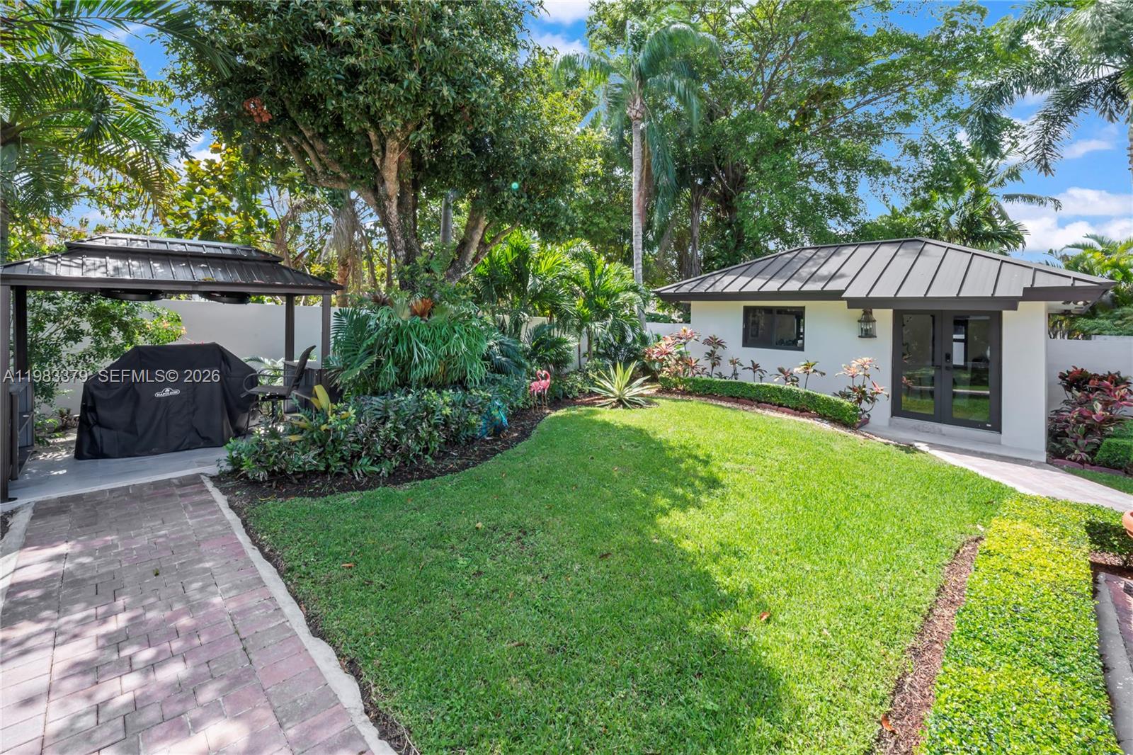 10320 Southwest 139th Street Miami, FL 33176 - Photo 57 of 100 a view of a house with backyard and sitting area