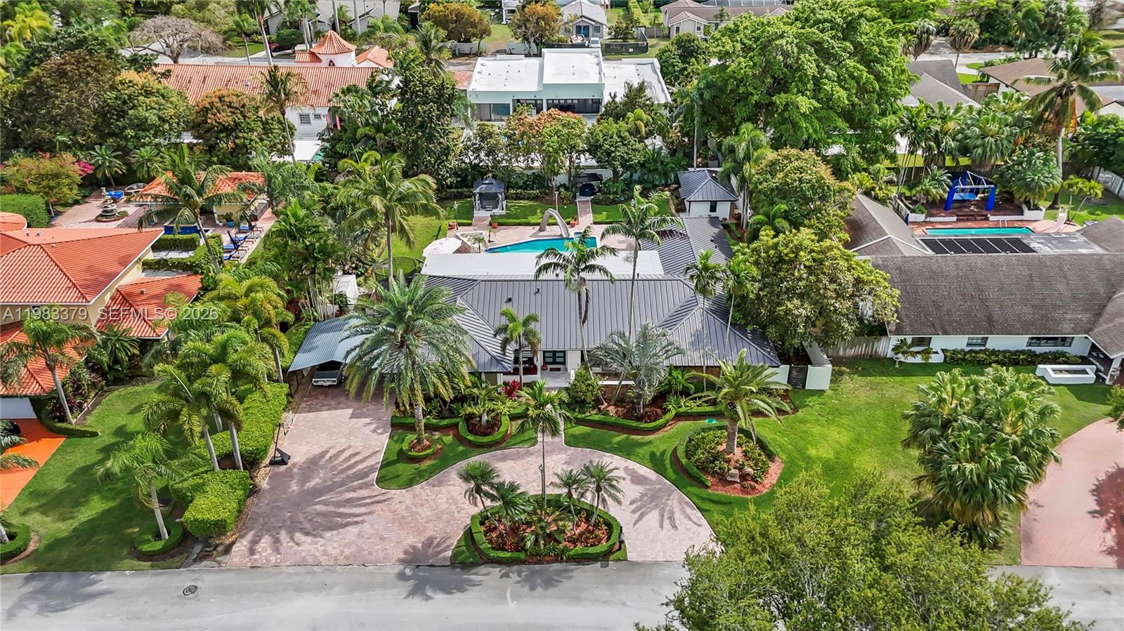10320 Southwest 139th Street Miami, FL 33176 - Photo 72 of 100 an aerial view of a house with a yard and garden