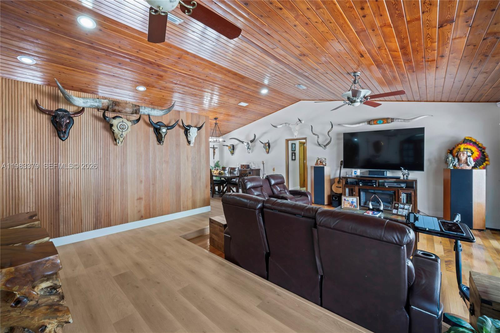 10320 Southwest 139th Street Miami, FL 33176 - Photo 9 of 100 a view of a livingroom with furniture and a flat screen tv