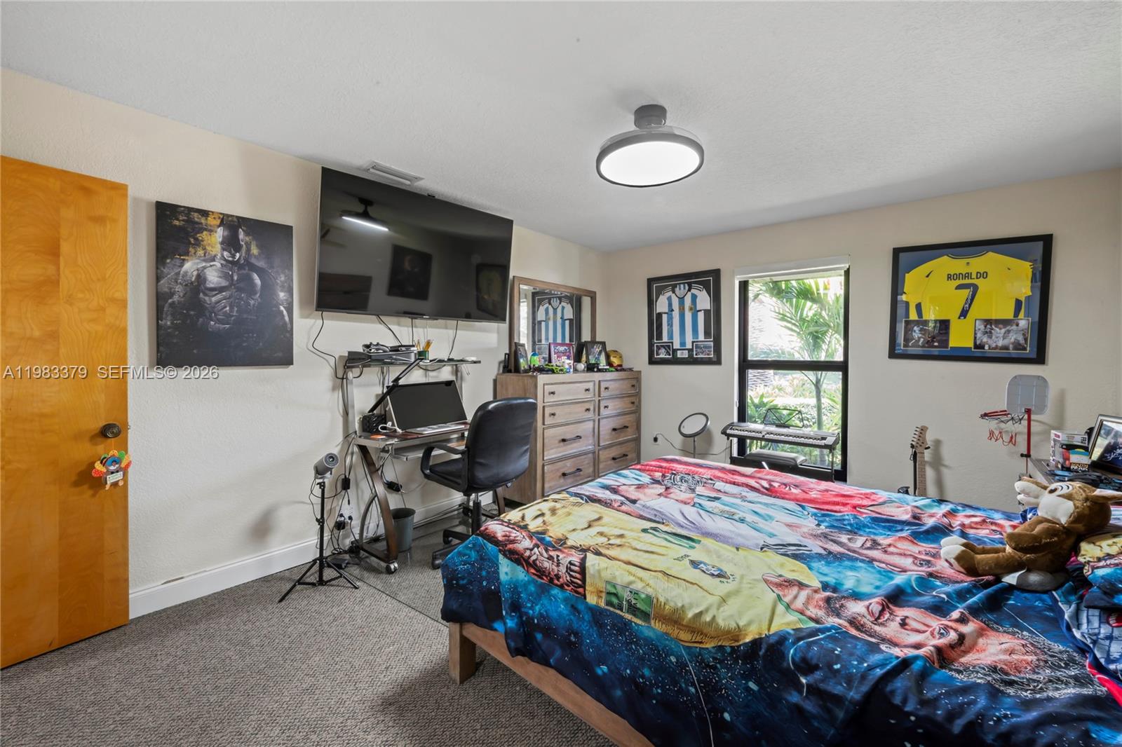 10320 Southwest 139th Street Miami, FL 33176 - Photo 91 of 100 a bedroom that has a bed and a tv in it