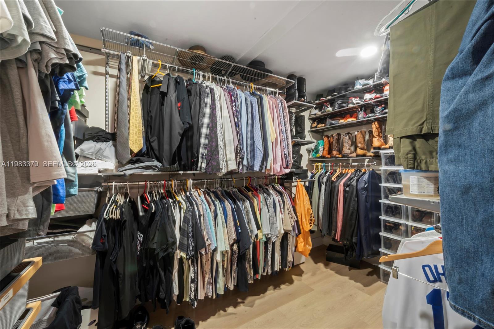 10320 Southwest 139th Street Miami, FL 33176 - Photo 95 of 100 a view of walk in closet with clothes
