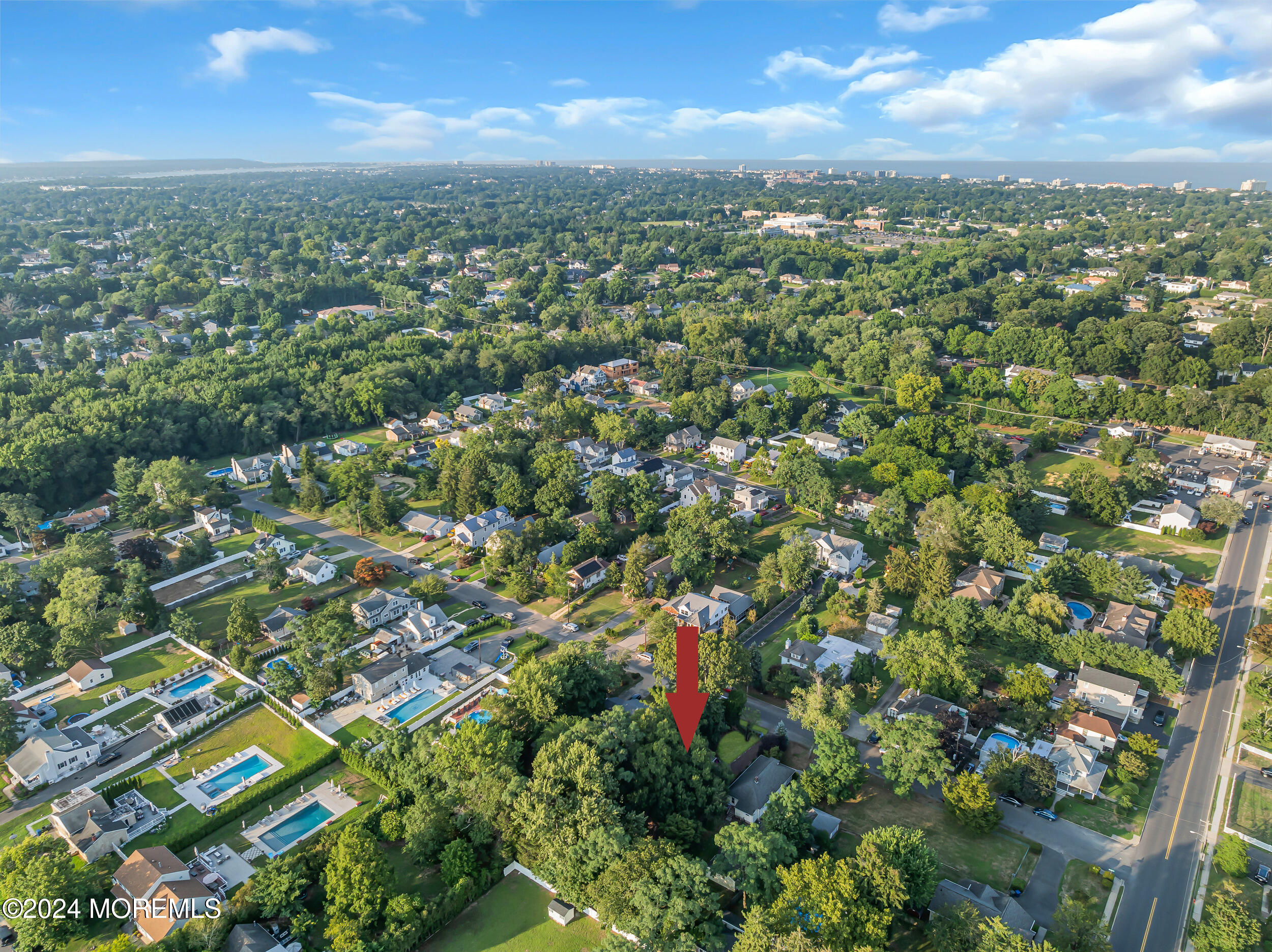 32 Woodrow Street Oakhurst, NJ 07755 - Photo 19 of 19 an aerial view of residential houses with outdoor space and trees