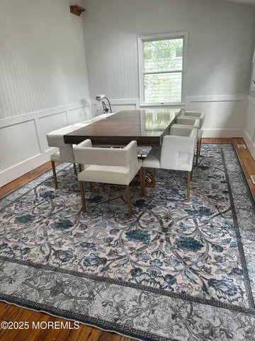 a bed sitting in a room next to a window