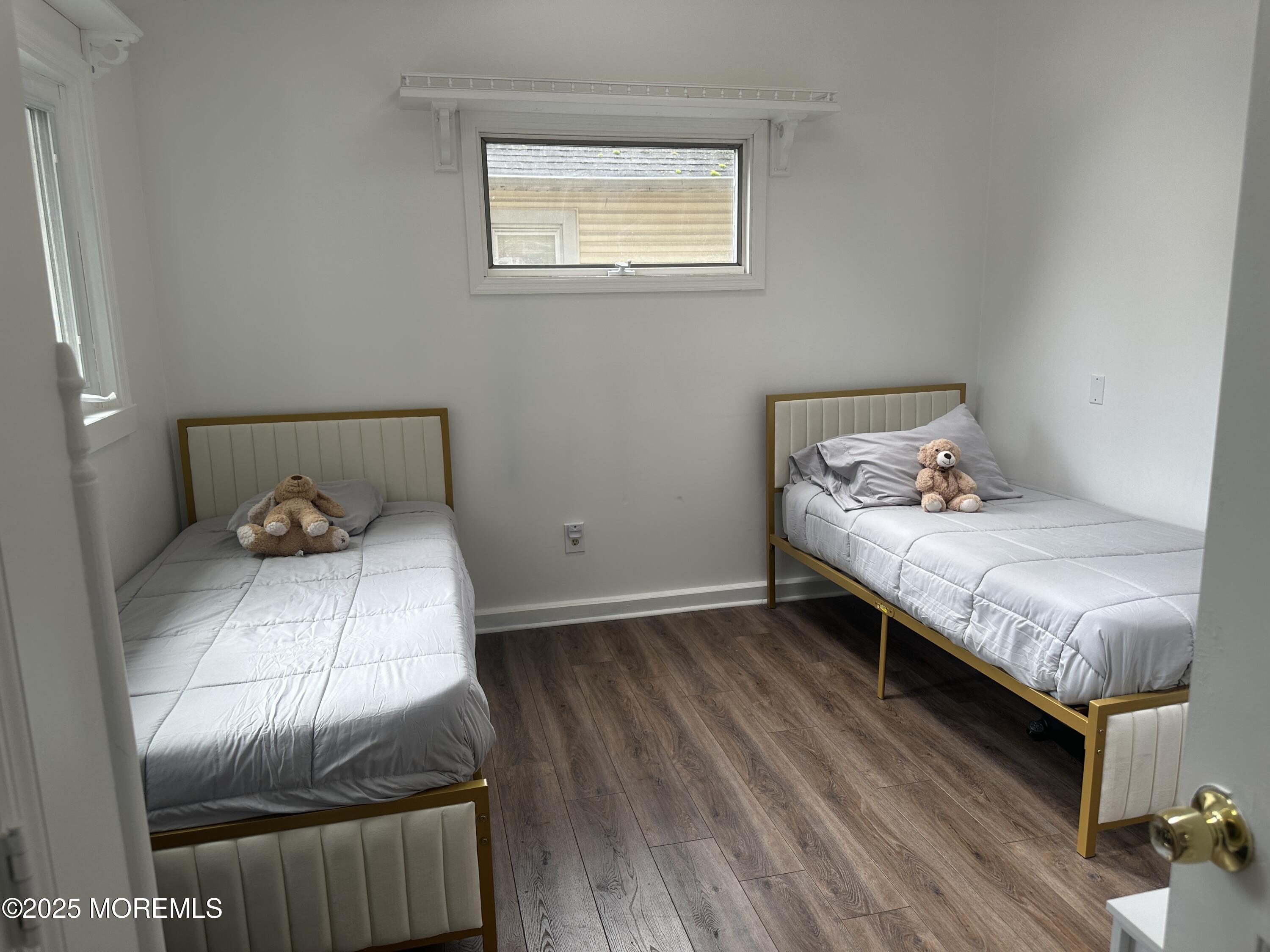 32 Woodrow Street Oakhurst, NJ 07755 - Photo 7 of 19 a bedroom with a bed and cabinets