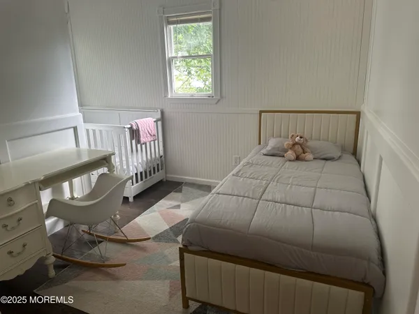 a bedroom with a bed and lamp