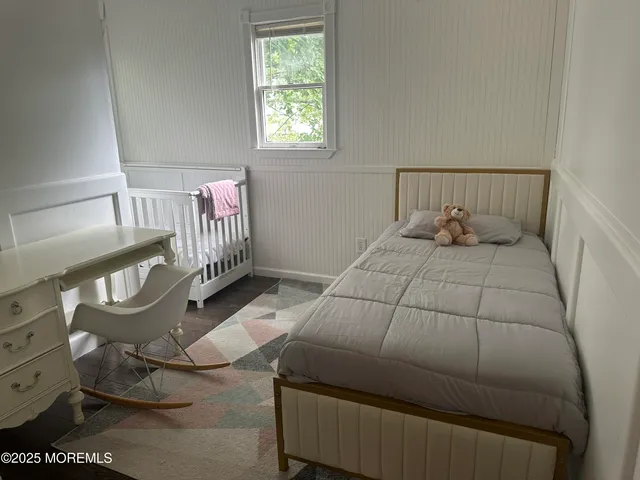 a bedroom with a bed and lamp