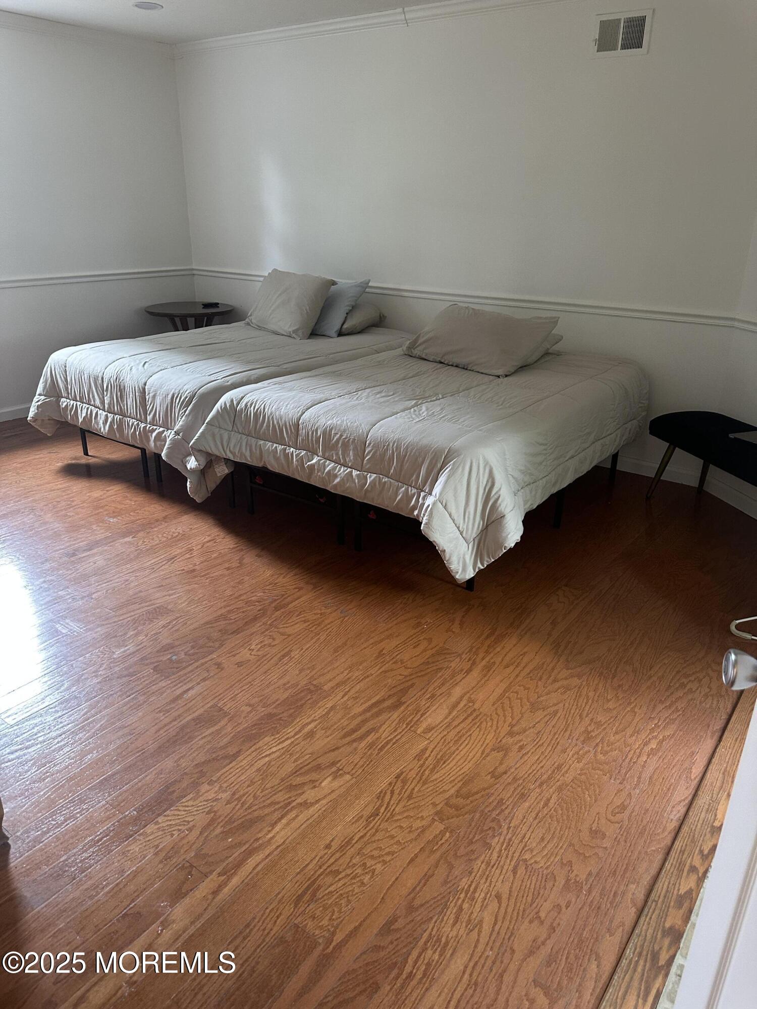 32 Woodrow Street Oakhurst, NJ 07755 - Photo 9 of 19 a bedroom with a bed and lamp