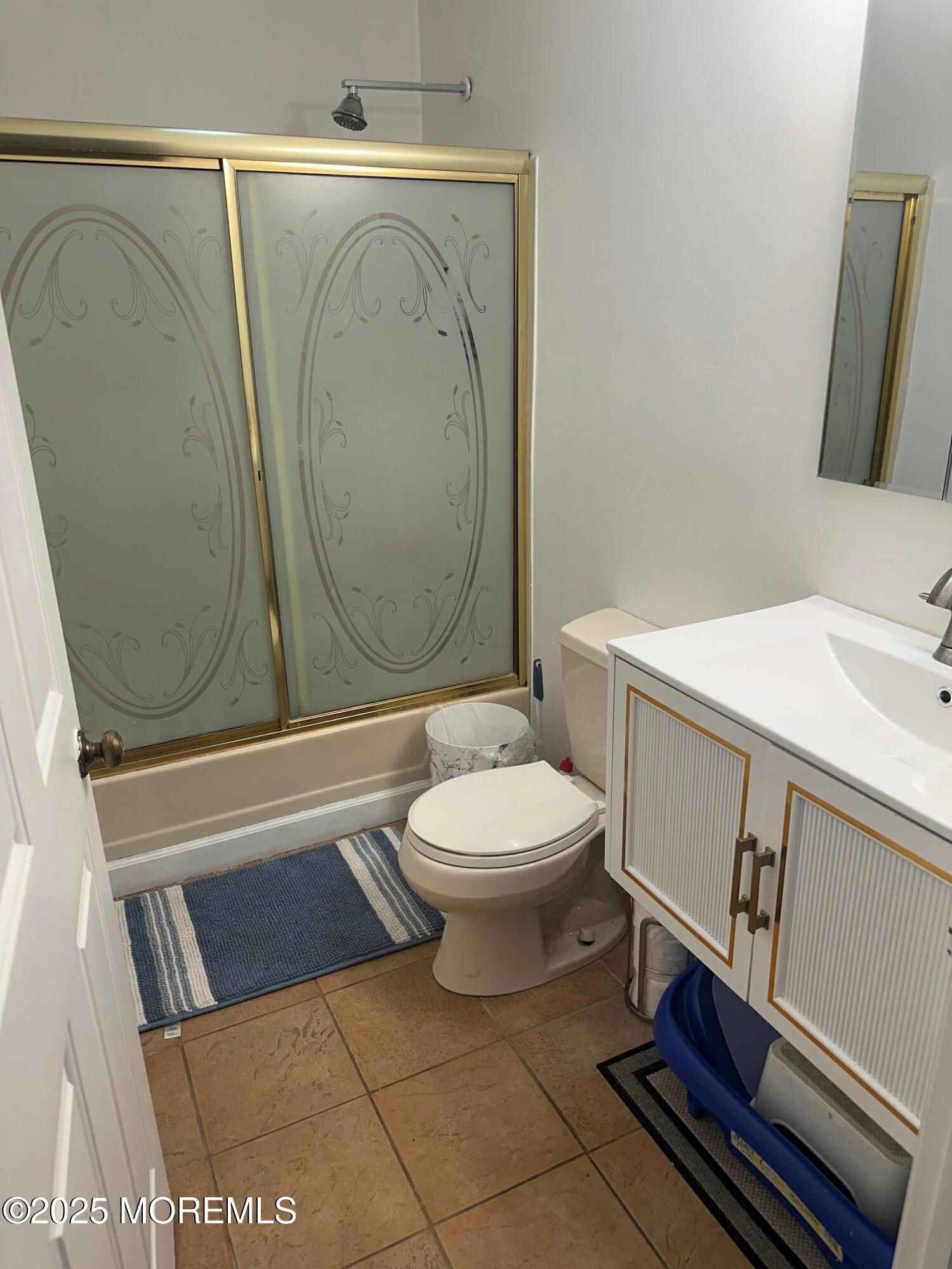 32 Woodrow Street Oakhurst, NJ 07755 - Photo 10 of 19 a bathroom with a toilet a sink and bathtub