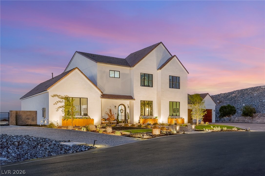 324 Wanda Road Henderson, NV 89002 - Photo 6 of 96 Striking contemporary lines and manicured desert landscaping define this impressive multi-level estate.