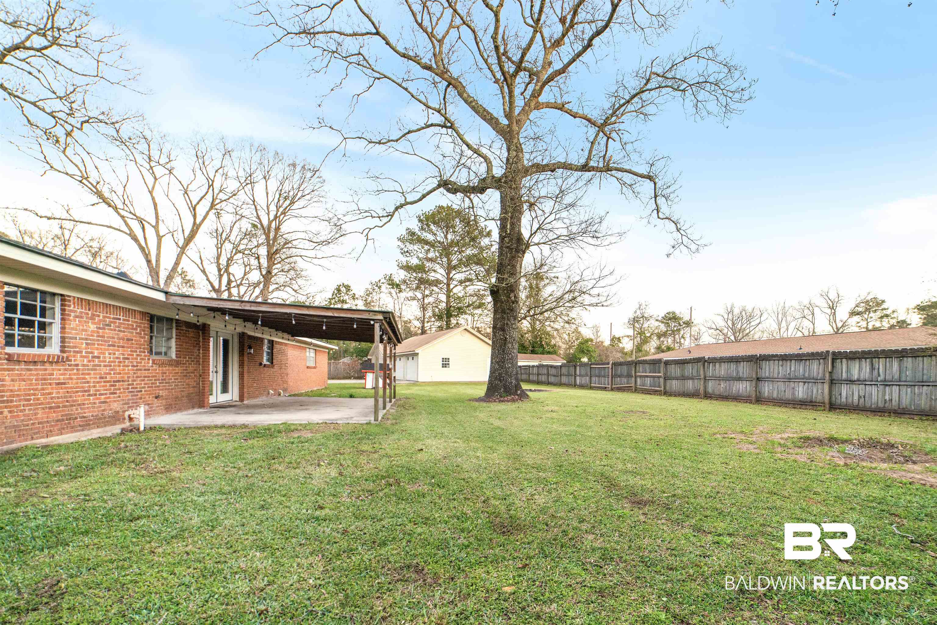 11833 Old Moffat Road Wilmer, AL 36587 - Photo 23 of 23 View of yard featuring a patio area and a fenced backyard