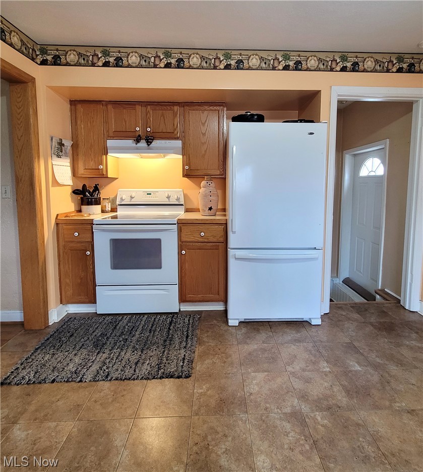 4520 4th Street Northwest Canton, OH 44708 - Photo 15 of 29 Kitchen featuring tile floors and white appliances