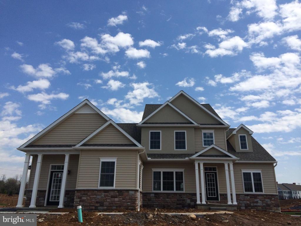 616 Frome Avenue, Unit 87 Lititz, PA 17543 - Photo 1 of 4 a front view of a house with yard