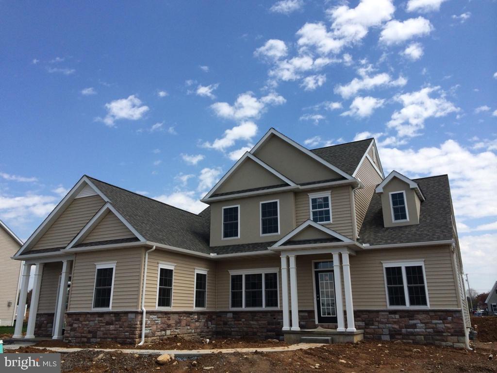 616 Frome Avenue, Unit 87 Lititz, PA 17543 - Photo 2 of 4 a front view of a house with yard