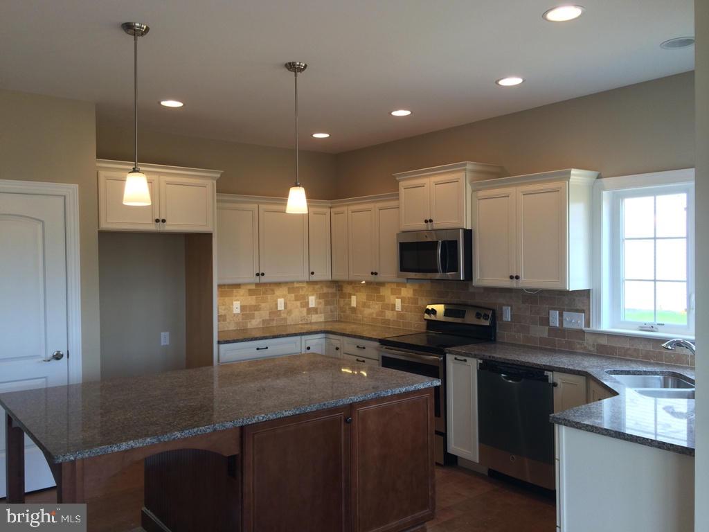 616 Frome Avenue, Unit 87 Lititz, PA 17543 - Photo 3 of 4 a kitchen with a sink stainless steel appliances and cabinets