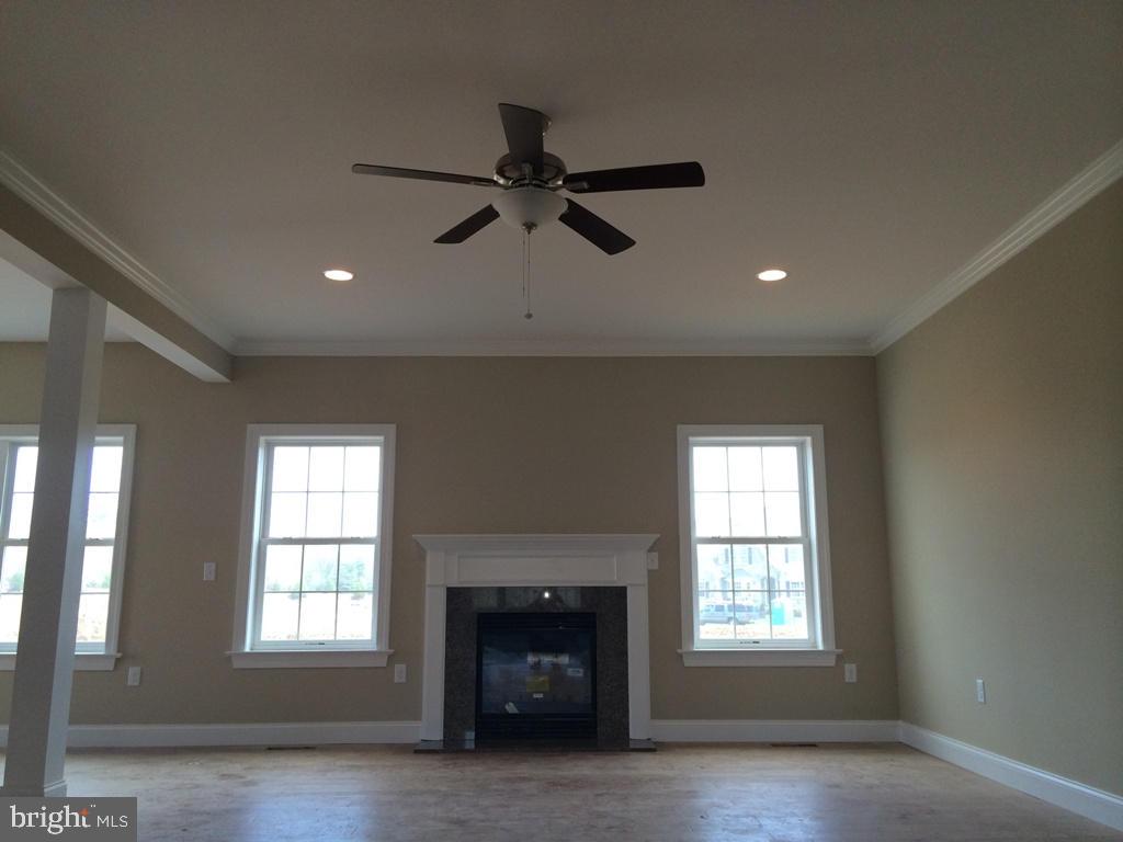 616 Frome Avenue, Unit 87 Lititz, PA 17543 - Photo 4 of 4 an empty room with windows and fireplace
