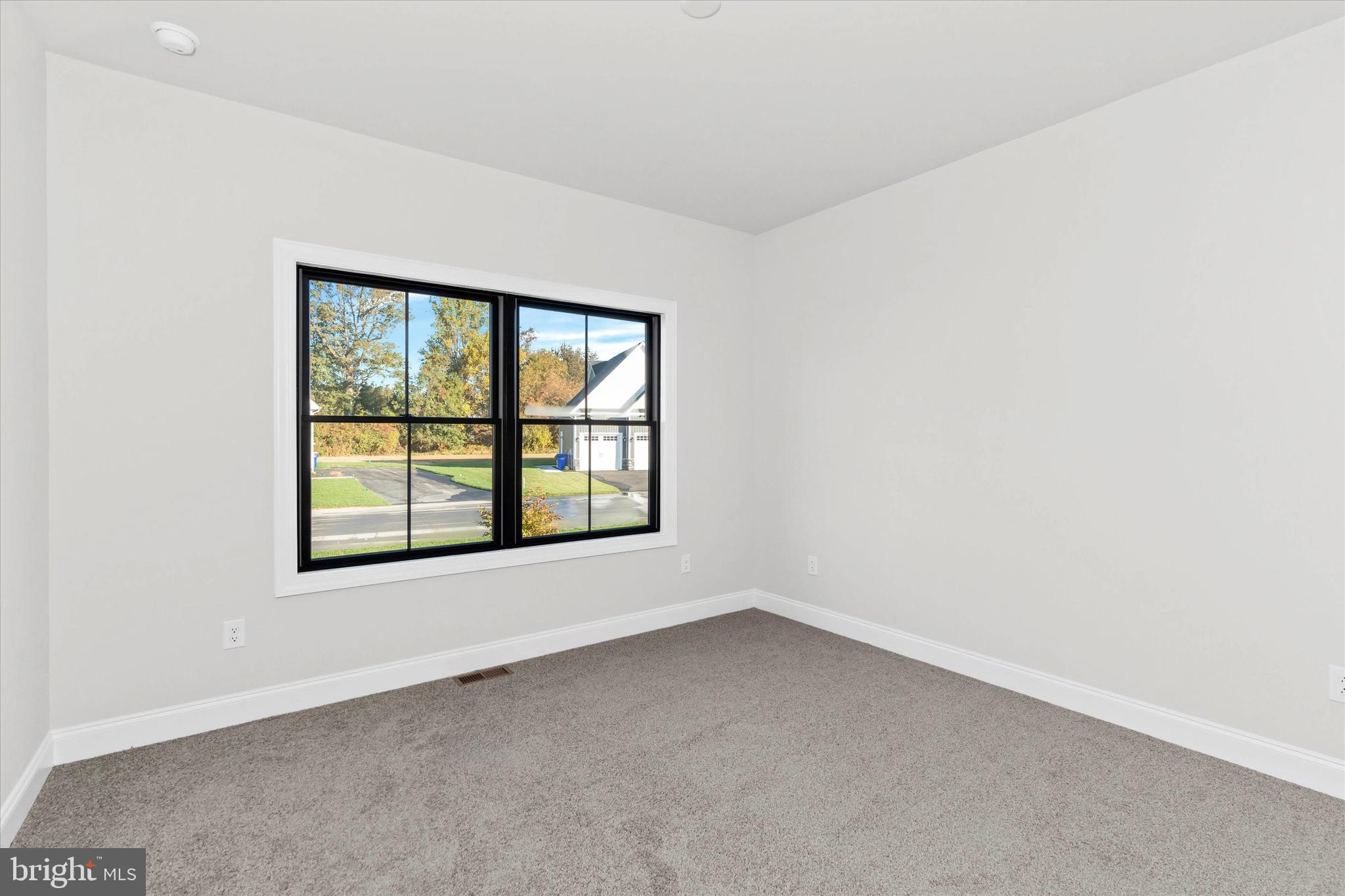 14274 Schooner Run, Unit 83 Ellendale, DE 19941 - Photo 31 of 56 an empty room with a window