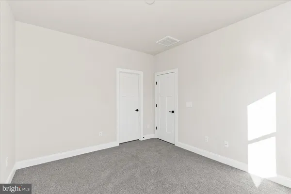 a view of a small space with wooden floor
