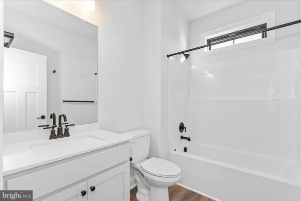 a bed room with a bed and a large window