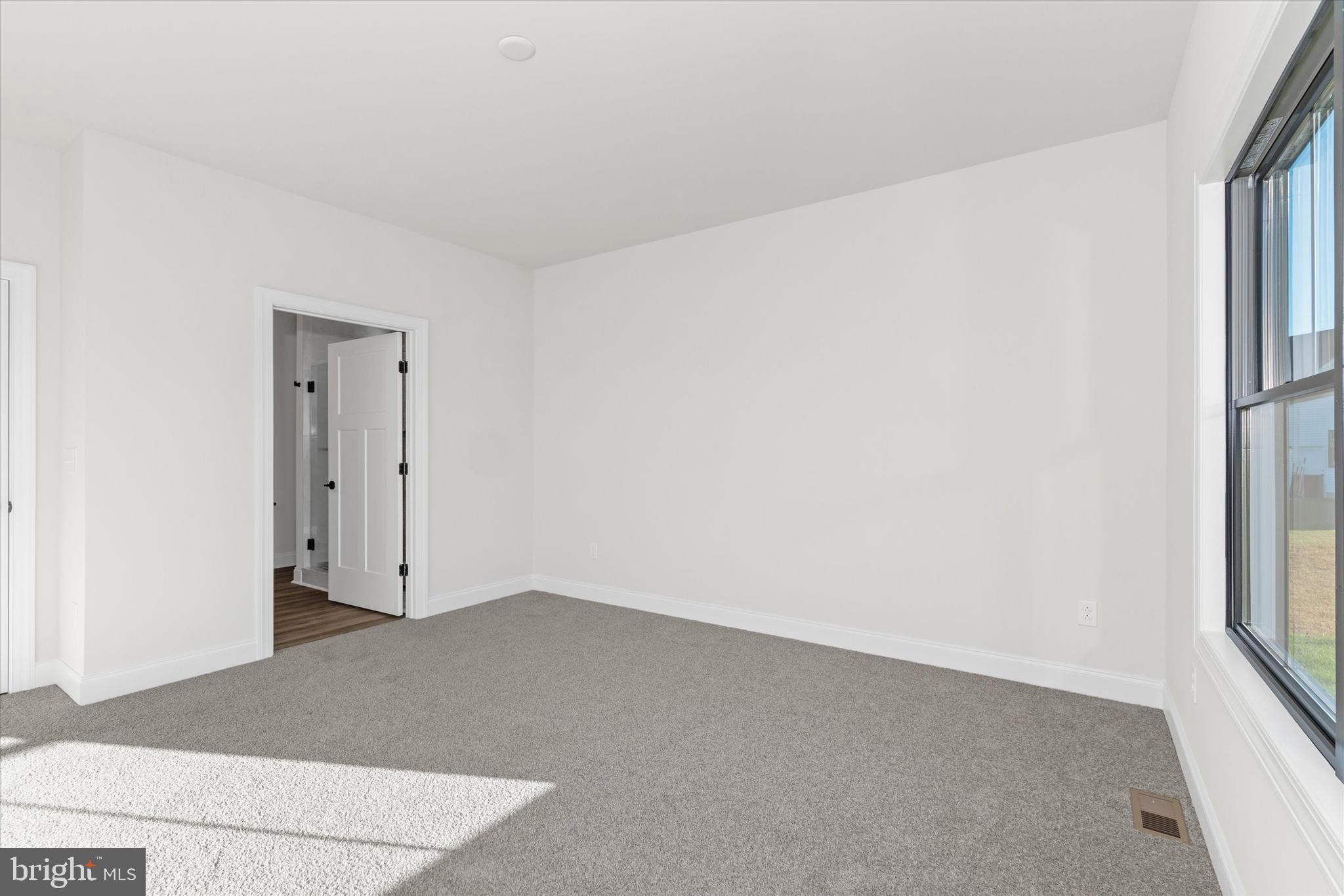14274 Schooner Run, Unit 83 Ellendale, DE 19941 - Photo 41 of 56 an empty room with windows