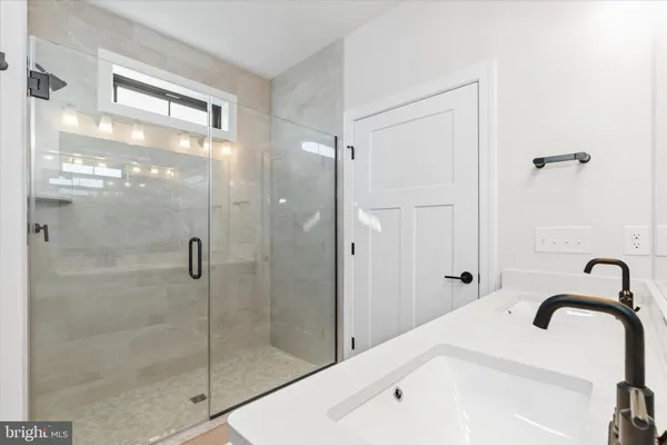 a view of a house with a backyard and a floor to ceiling window