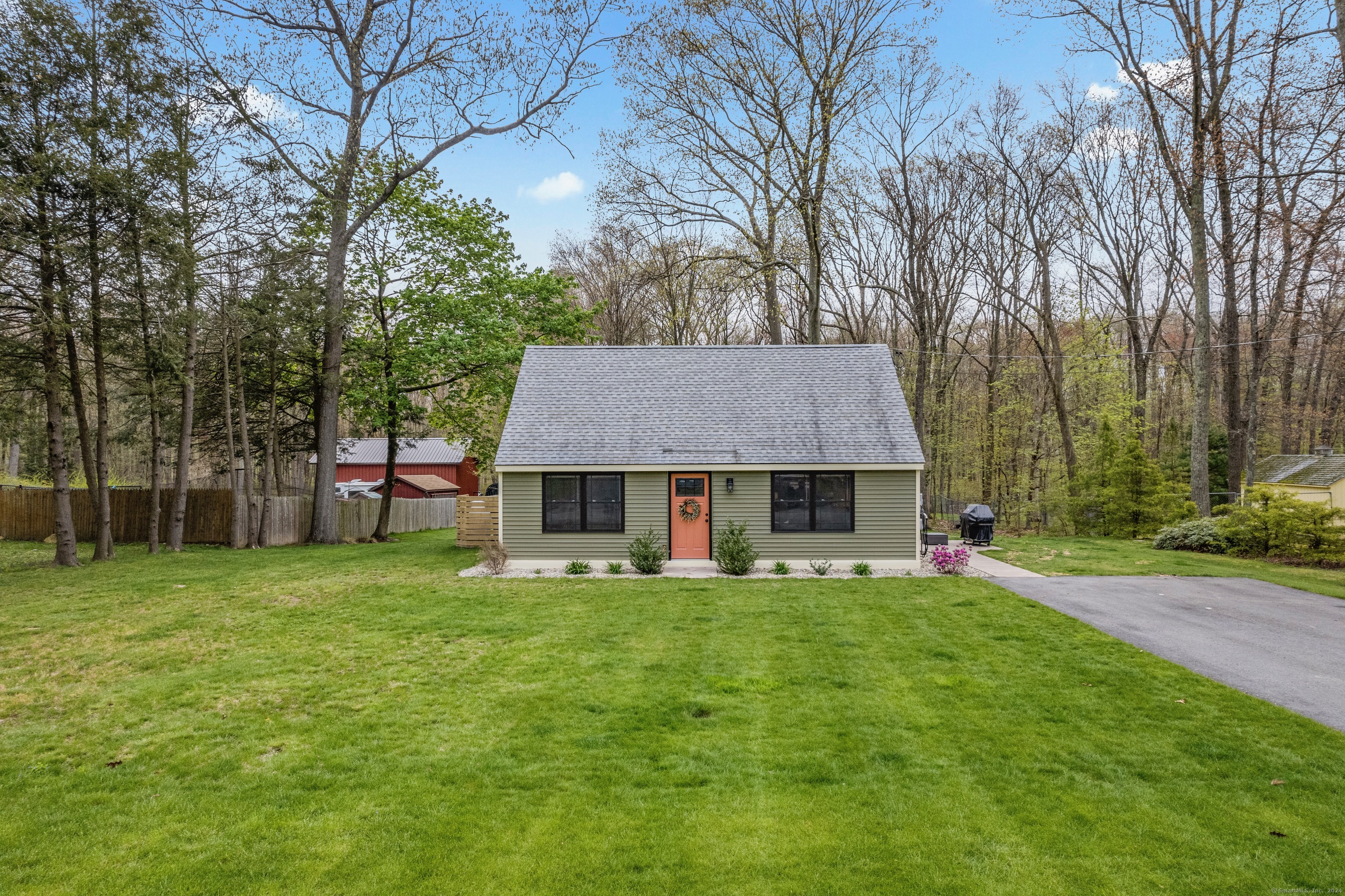 a view of a house with a yard