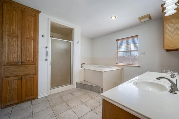 a kitchen that has a sink and a stove in it