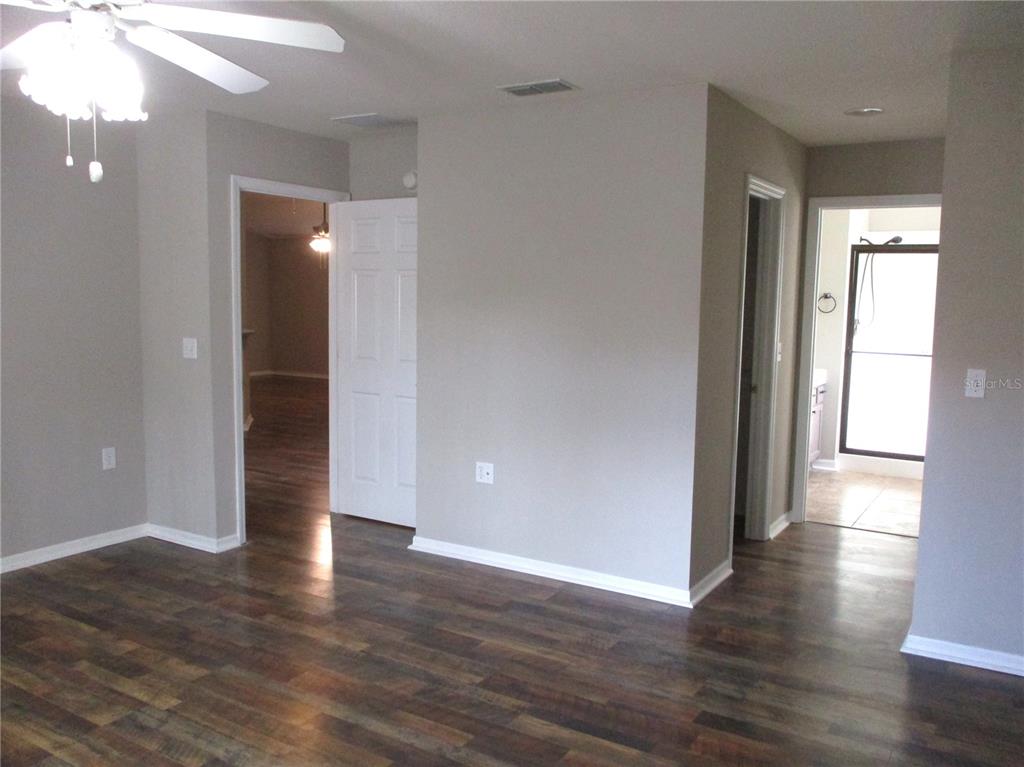 11536 Southwest 140th Loop Dunnellon, FL 34432 - Photo 16 of 75 a view of empty room with wooden floor