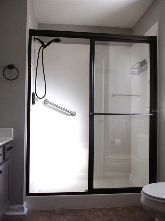 11536 Southwest 140th Loop Dunnellon, FL 34432 - Photo 23 of 75 a bathroom with a glass shower door