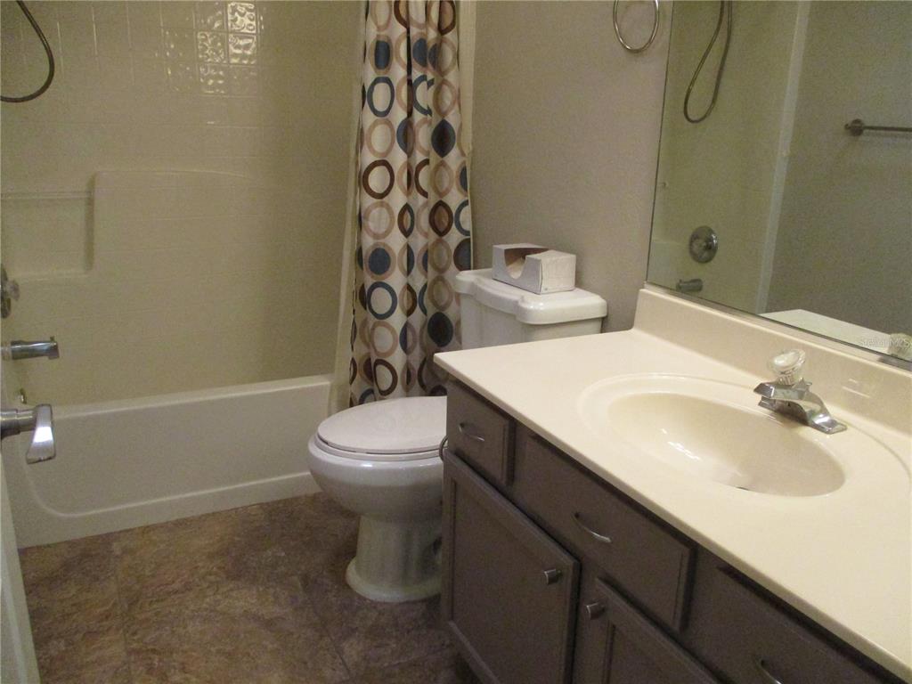 11536 Southwest 140th Loop Dunnellon, FL 34432 - Photo 28 of 75 a bathroom with a sink a toilet and shower