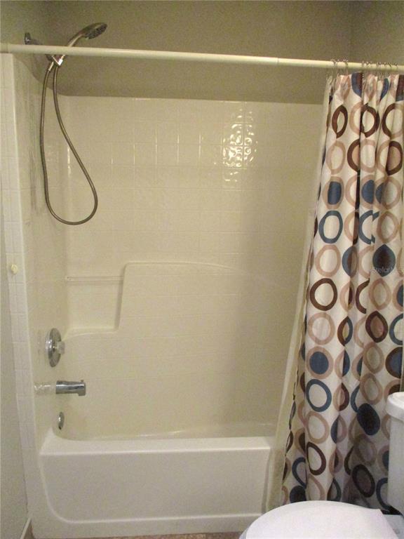 11536 Southwest 140th Loop Dunnellon, FL 34432 - Photo 30 of 75 a bathroom with a shower and a toilet