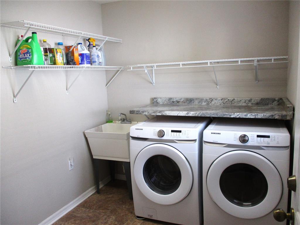 11536 Southwest 140th Loop Dunnellon, FL 34432 - Photo 38 of 75 a utility room with dryer and washer