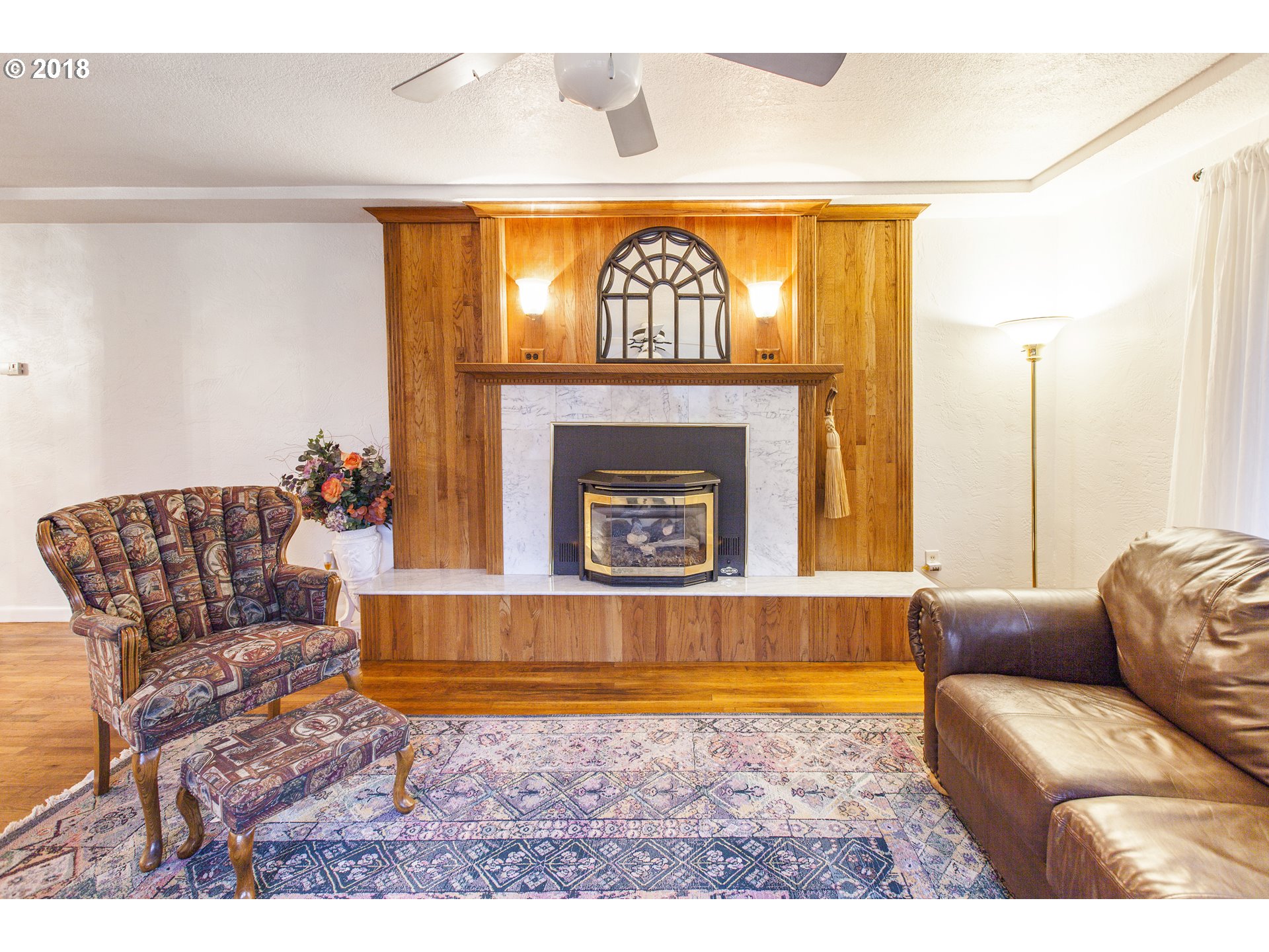 2483 Southeast Territorial Road Canby, OR 97013 - Photo 11 of 30 a living room with furniture and a fireplace