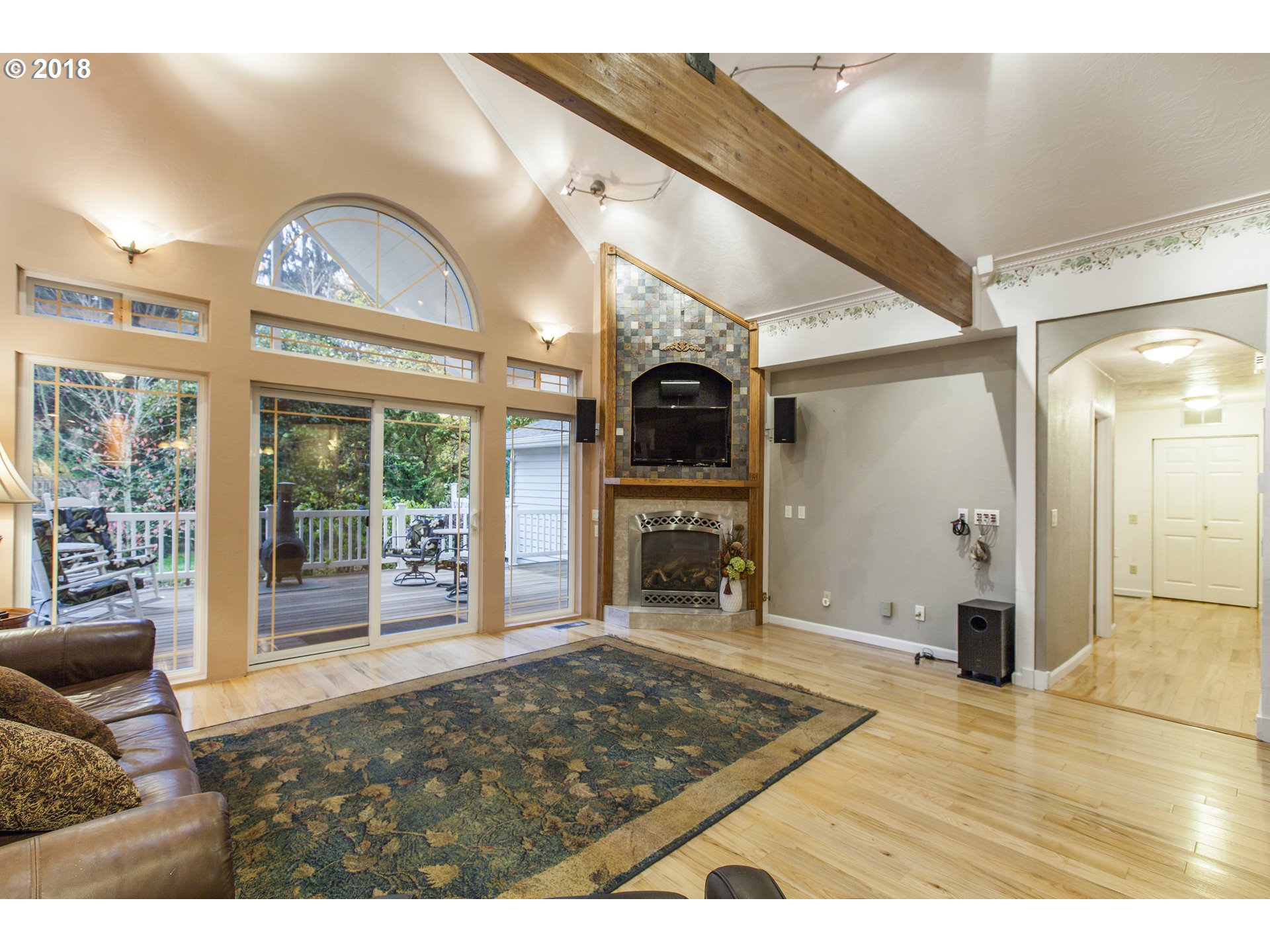 2483 Southeast Territorial Road Canby, OR 97013 - Photo 14 of 30 a living room with fireplace furniture and a floor to ceiling window