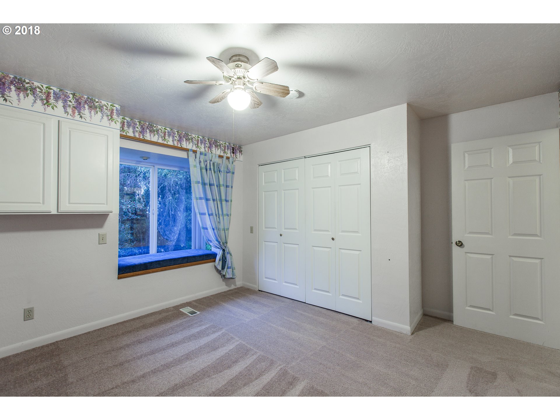 2483 Southeast Territorial Road Canby, OR 97013 - Photo 25 of 30 a view of an empty room with chandelier fan and wooden floor