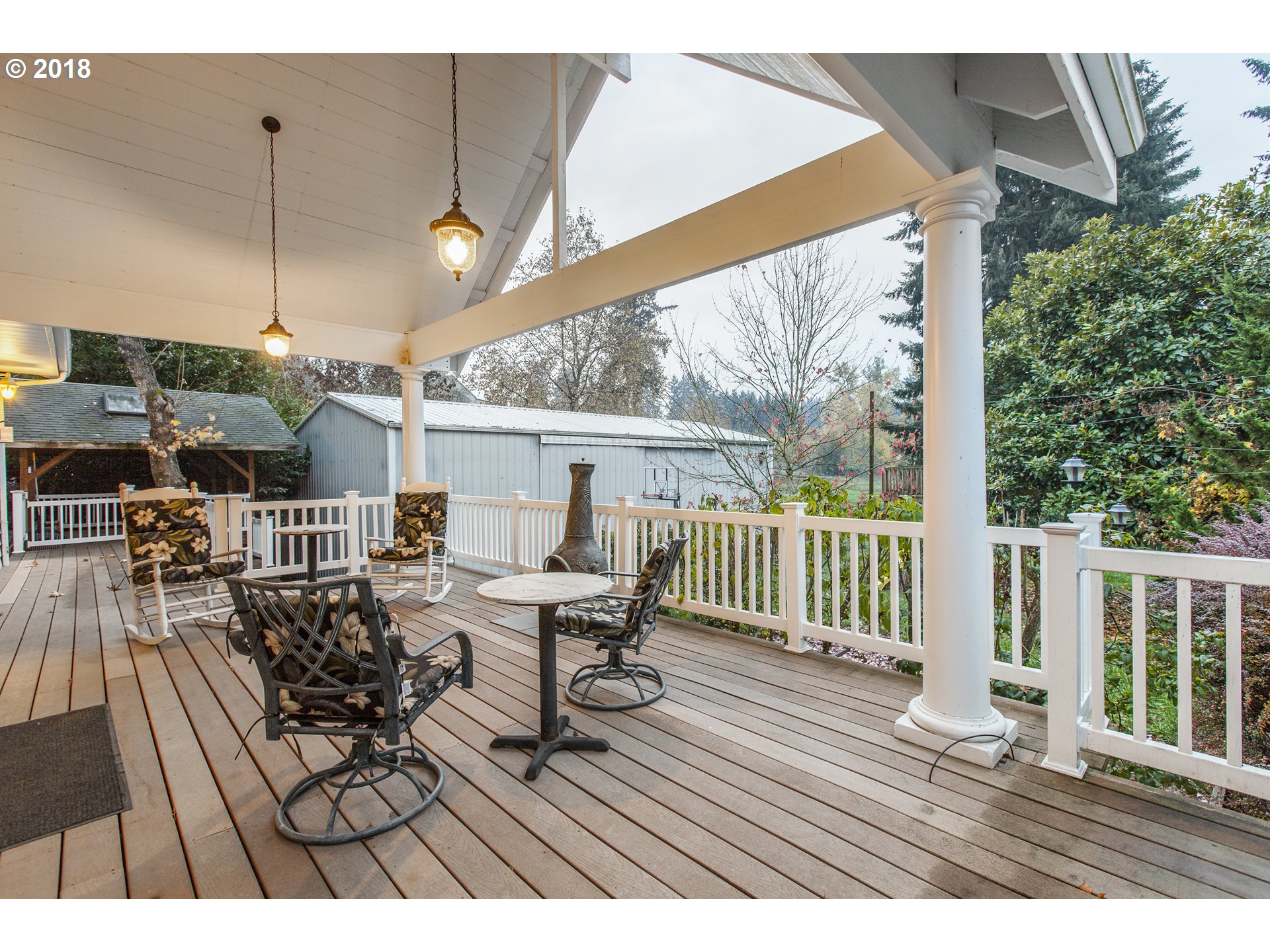2483 Southeast Territorial Road Canby, OR 97013 - Photo 7 of 30 a view of balcony with chairs and wooden floor
