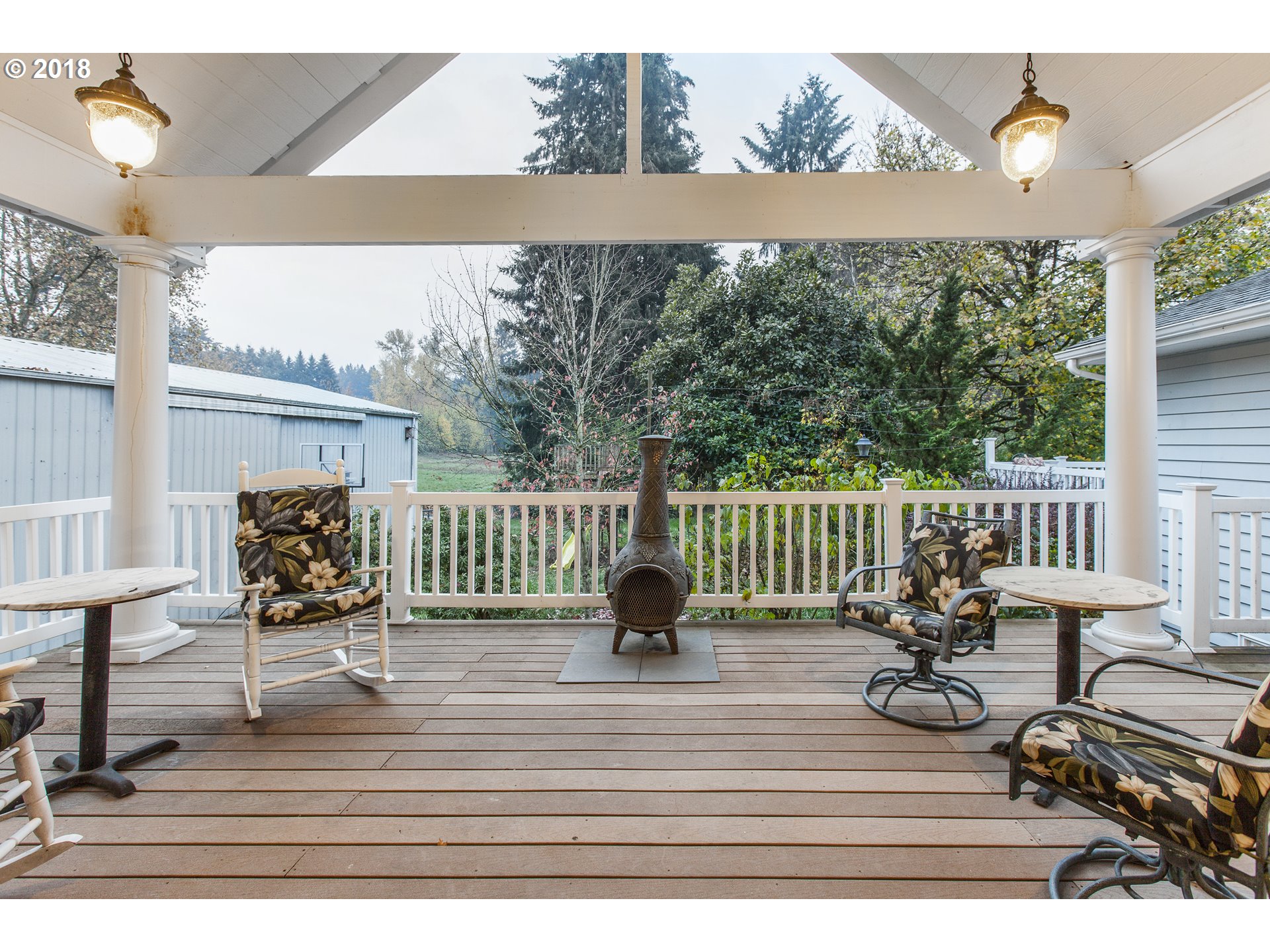 2483 Southeast Territorial Road Canby, OR 97013 - Photo 8 of 30 a view of a chairs and table on the deck
