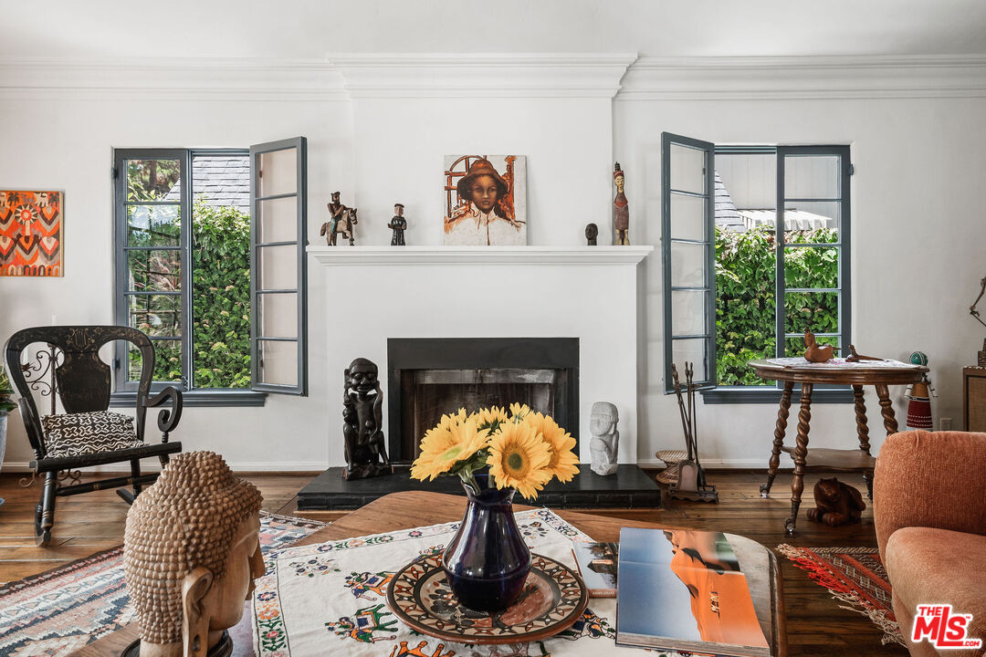 447 9th Street Santa Monica, CA 90402 - Photo 12 of 58 a living room with furniture a window and a fireplace